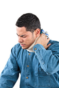 Injured male holding his neck in pain